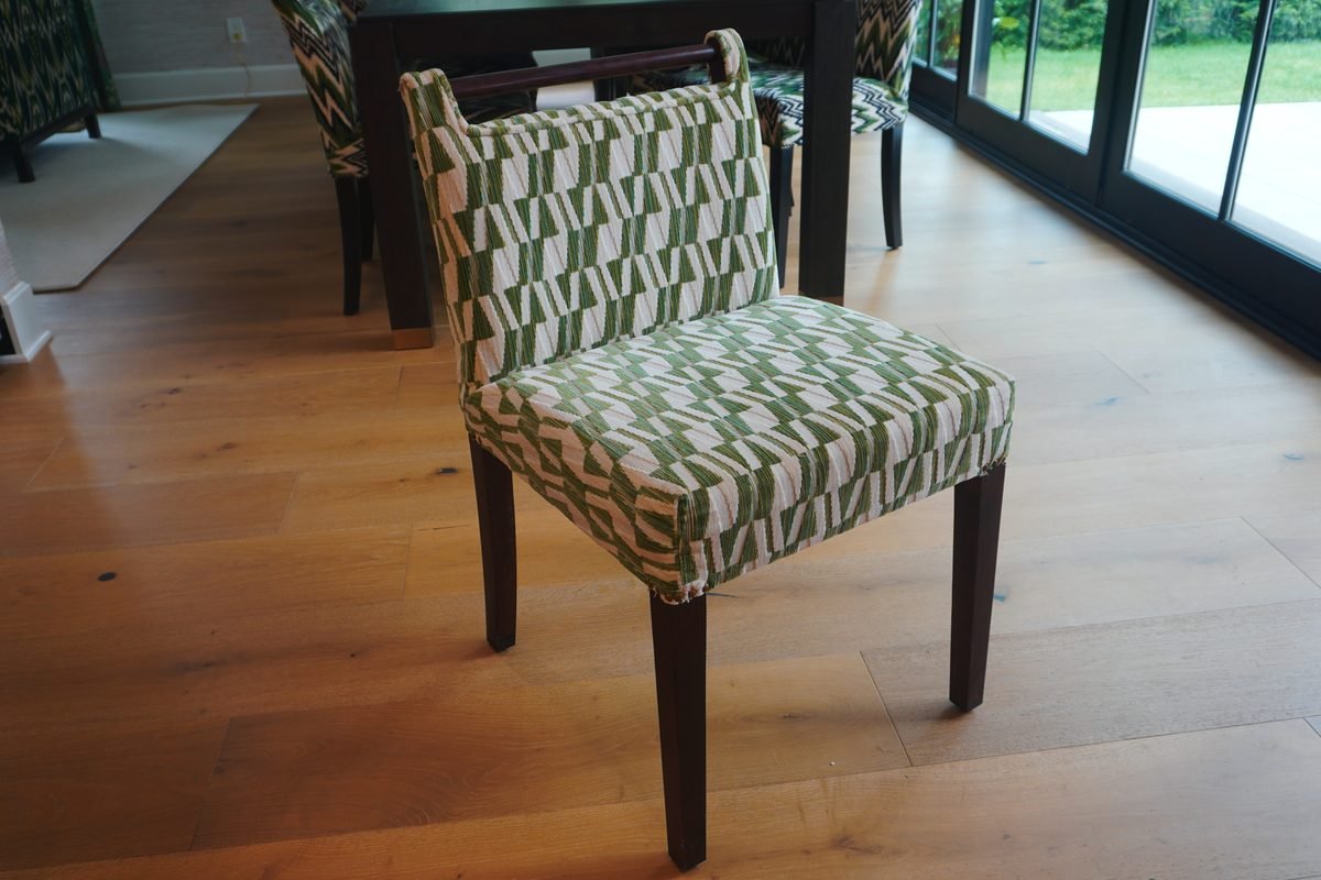 Custom tailored armchair placed in a brightly lit modern living room