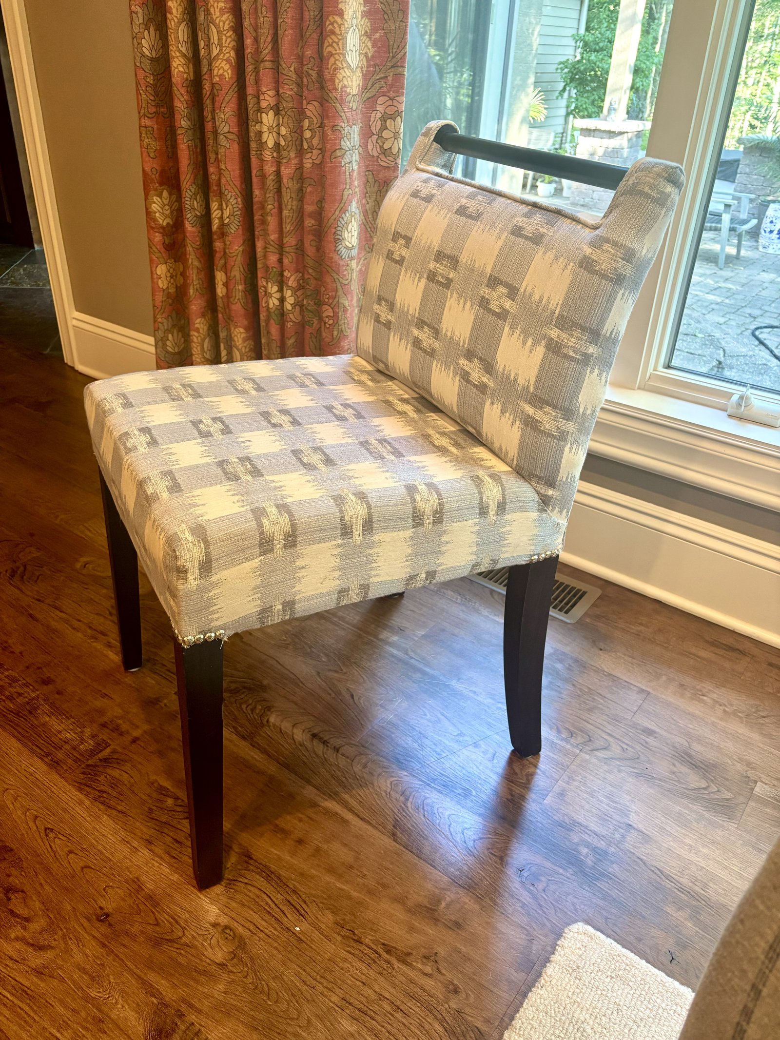 Detail view of a beige upholstered custom dining chair