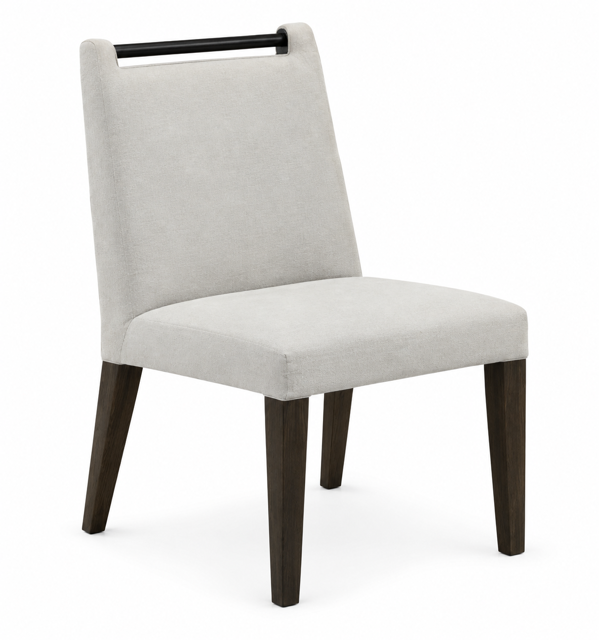 Handcrafted dining chair upholstered in light neutral fabric on a studio background